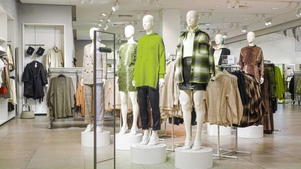 View into a store with dressed mannequins