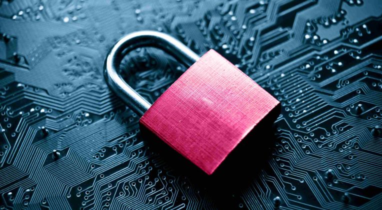 You can see a pink lock lying on a circuit board.